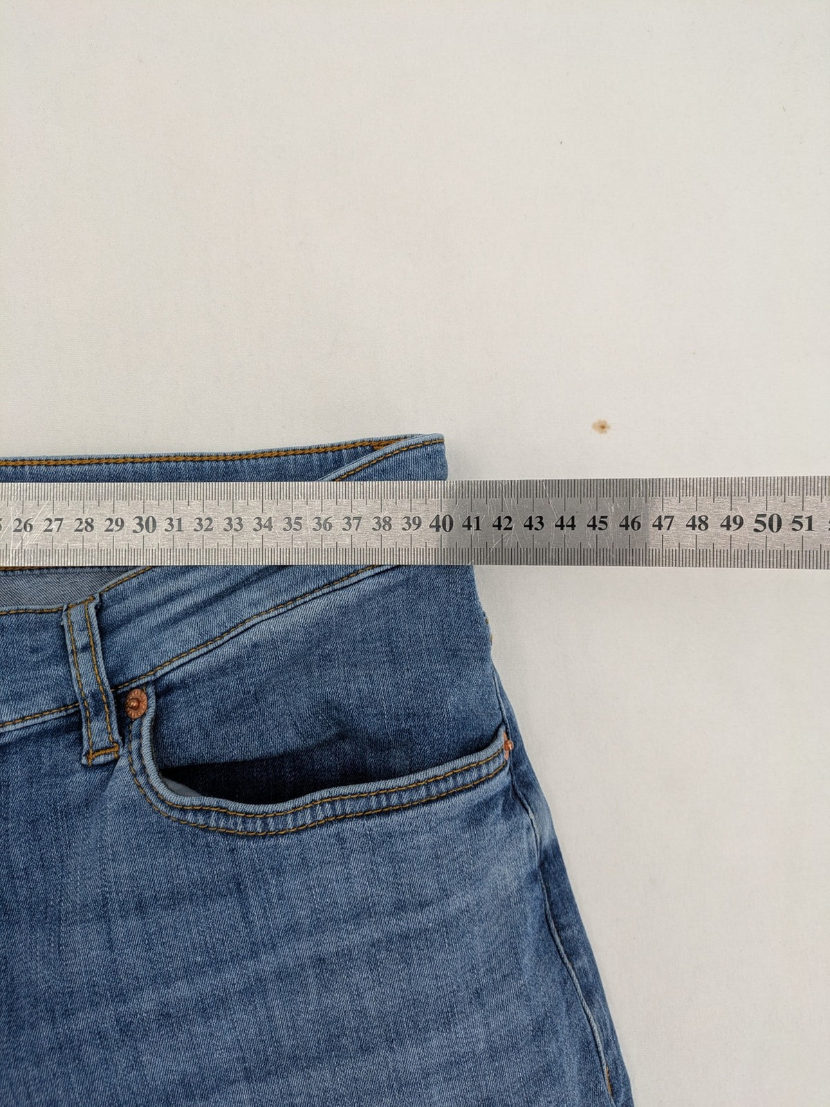 Drykorn blue straight jeans with stretch denim, classic fit, and logo patch on waistband.