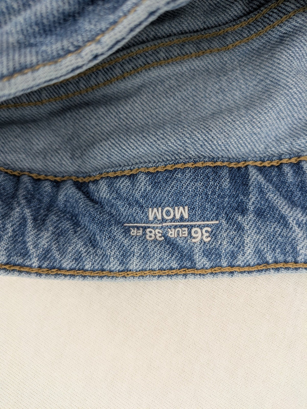 C&A blue mom jeans high waist with unique patchwork design and soft stretch denim.