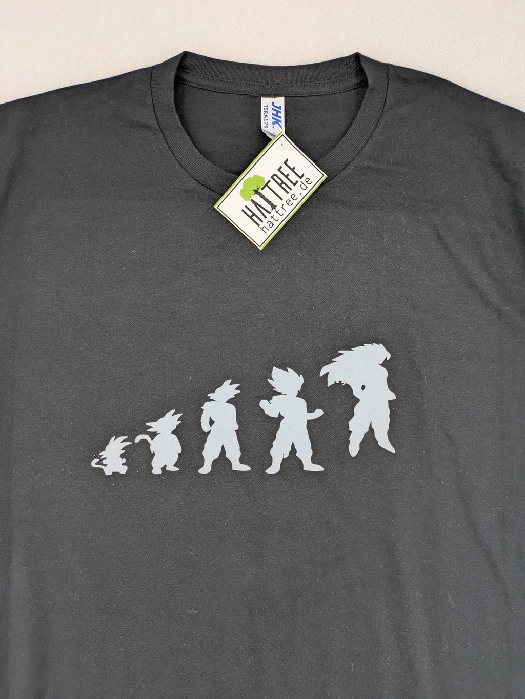 Dragon Ball Z blue and grey t-shirt featuring Son Goku evolution graphic, 100% cotton.