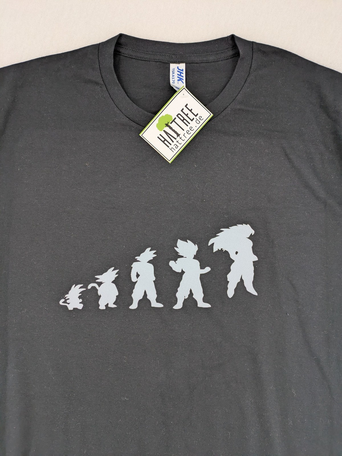 Dragon Ball Z blue and grey t-shirt featuring Son Goku evolution graphic, 100% cotton.