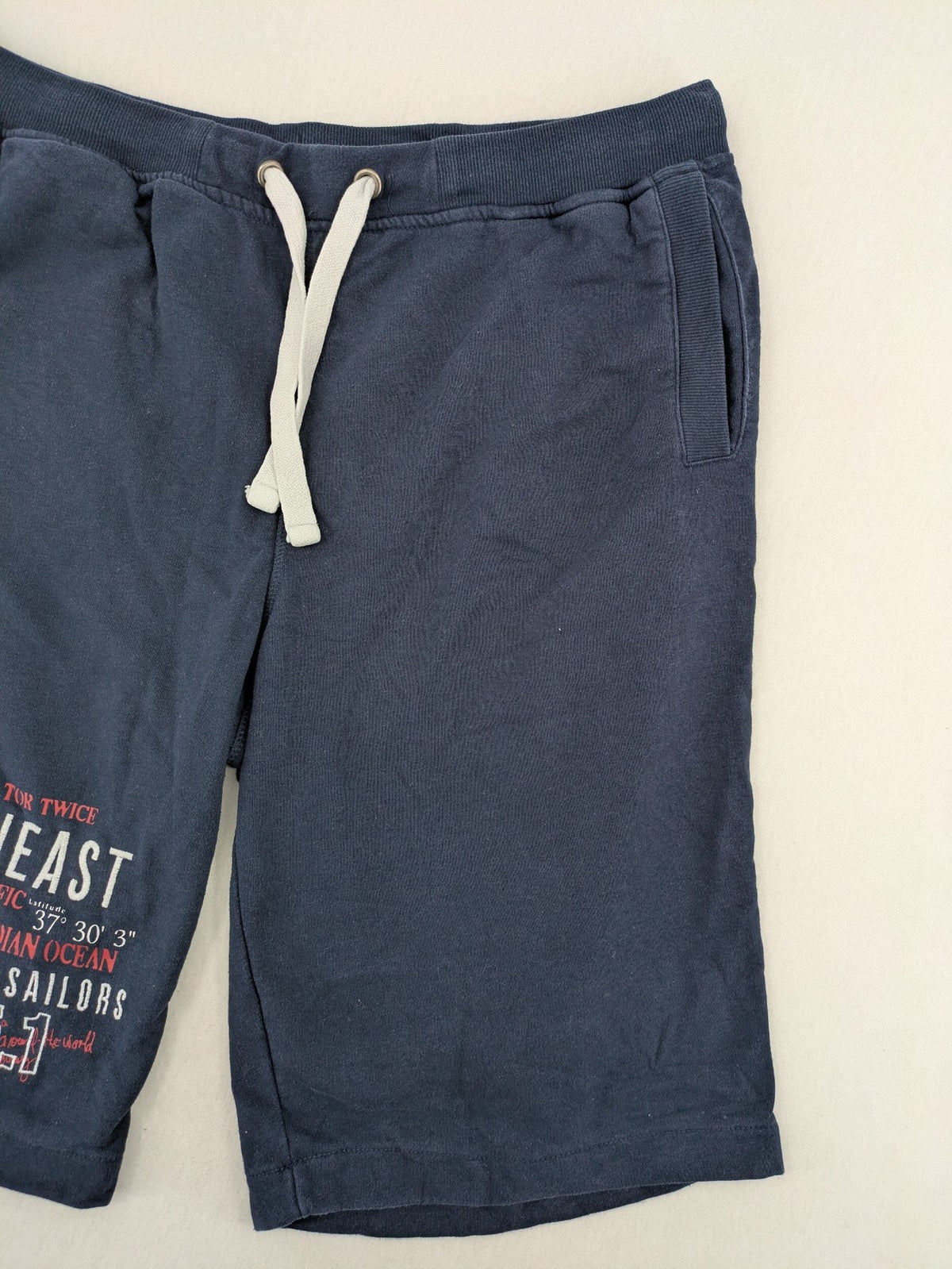 Livergy blue sweatshorts with "Northeast Sailors" graphic print and elastic waistband.
