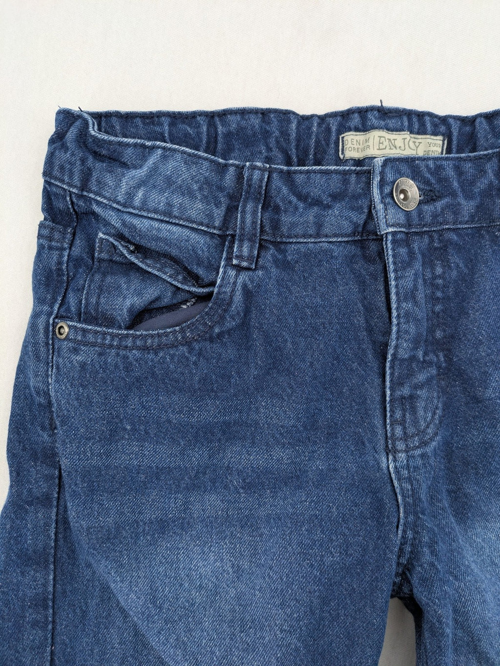 Pocopiano blue denim shorts with rolled cuffs and elastic waistband for comfort.
