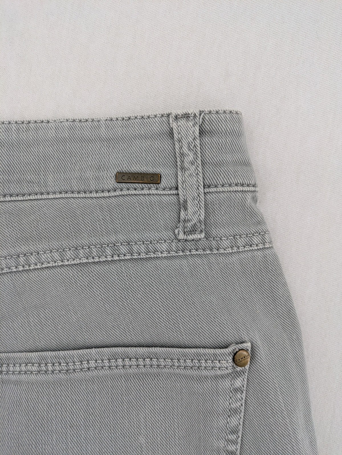 Cambio grey straight leg jeans with five-pocket design and logo button closure.
