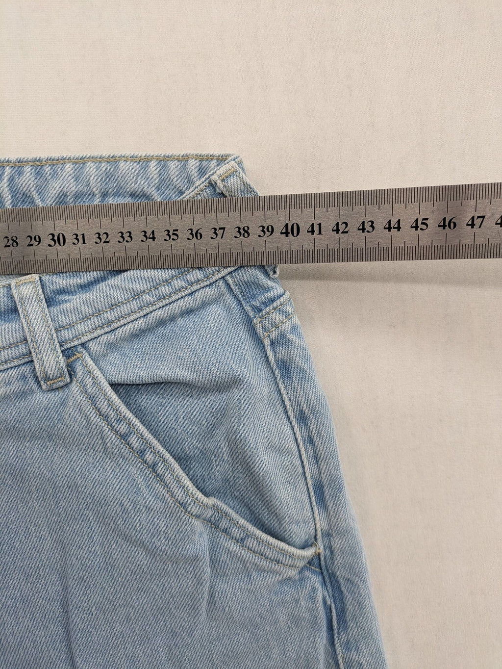 MNG blue straight jeans with cargo pockets and raw hem, high waist denim.