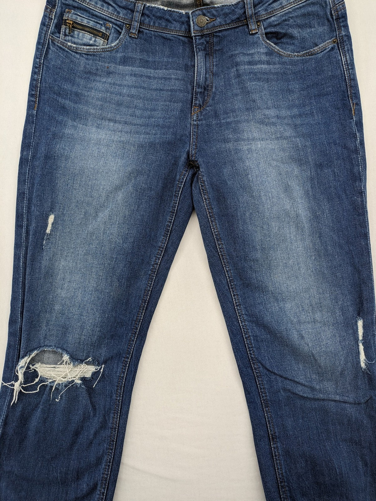 Esprit blue straight leg jeans with ripped knee details and rolled hem.