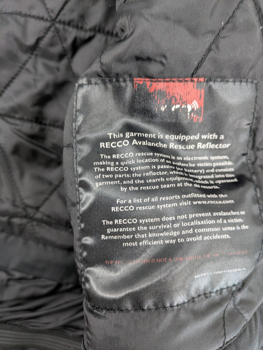 Icepeak black and white ski snowboard jacket with RECCO logo and quilted insulation.