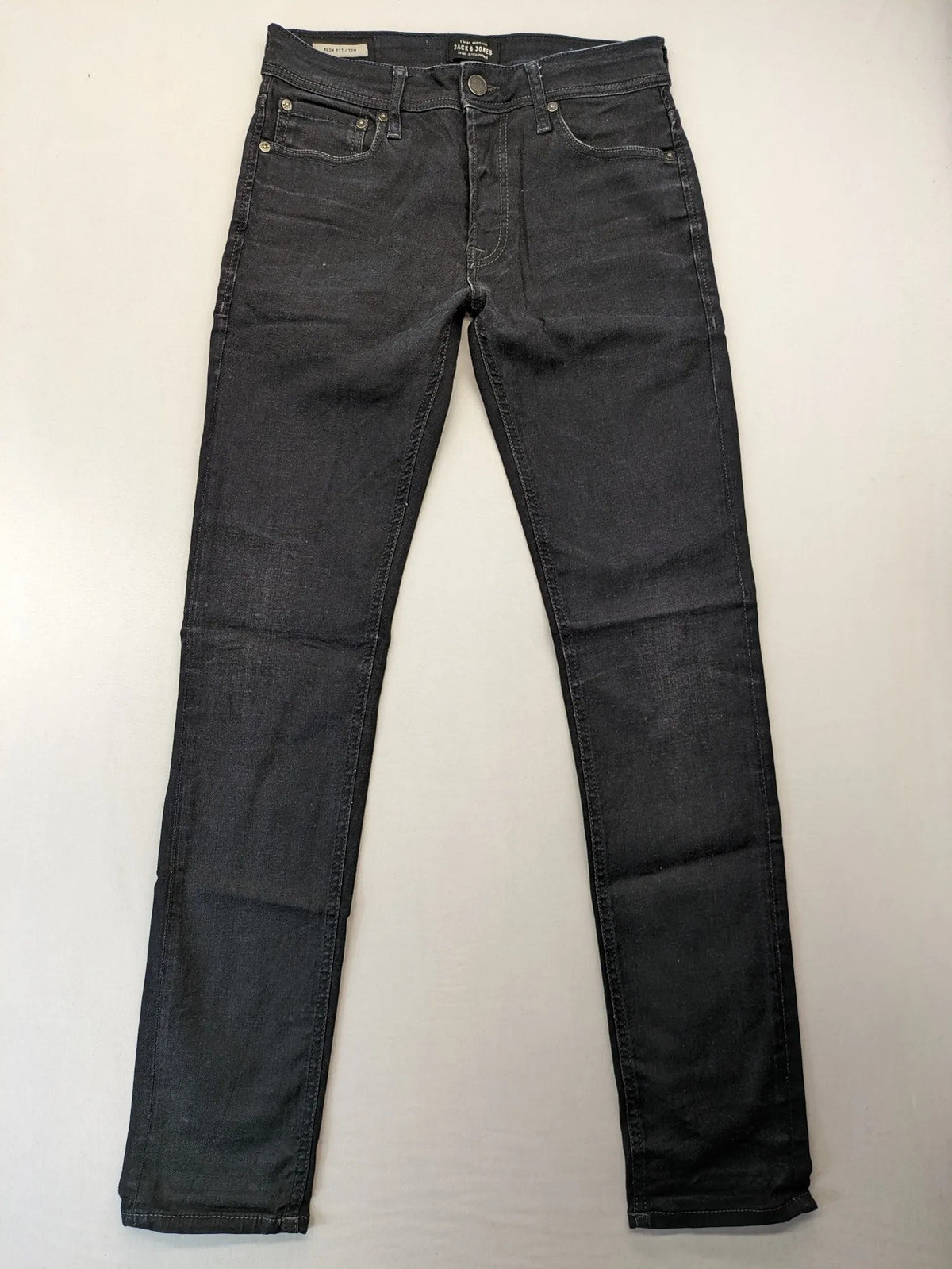 Jack & Jones grey slim fit jeans with classic 5-pocket style and button closure.