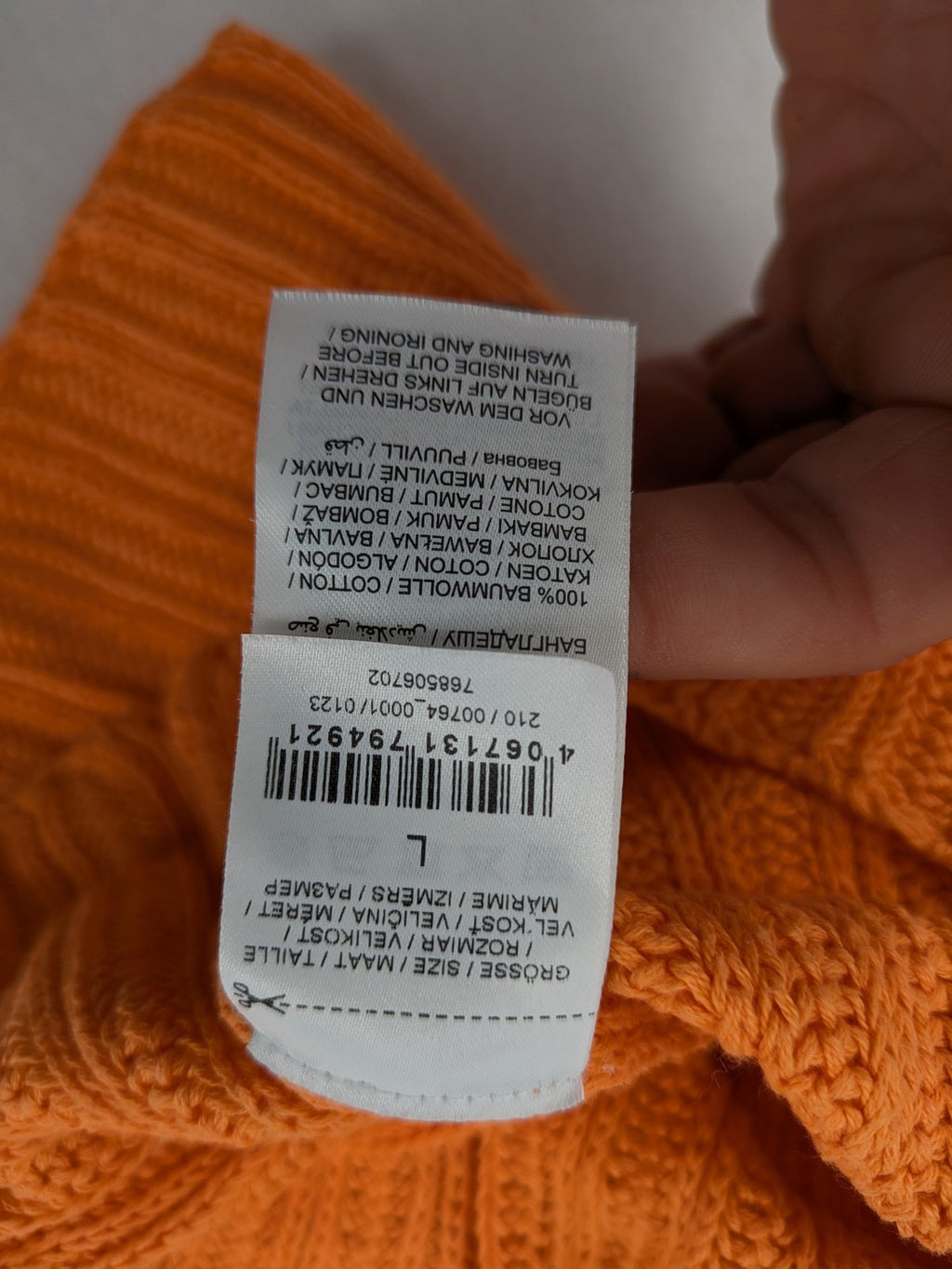 REVIEW orange crochet top with V-neck and peplum hem, made from 100% cotton.