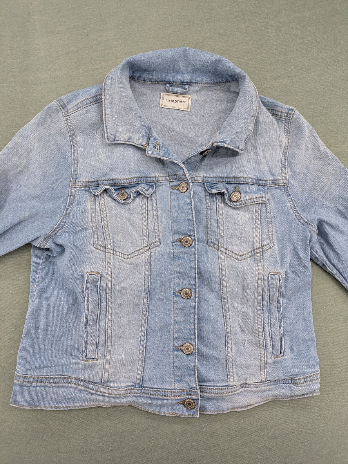 Pimkie blue denim jacket with classic cut, button placket, and two chest pockets.