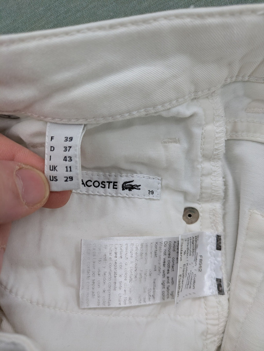 Lacoste white straight jeans high rise slim fit with logo and stretch denim material.