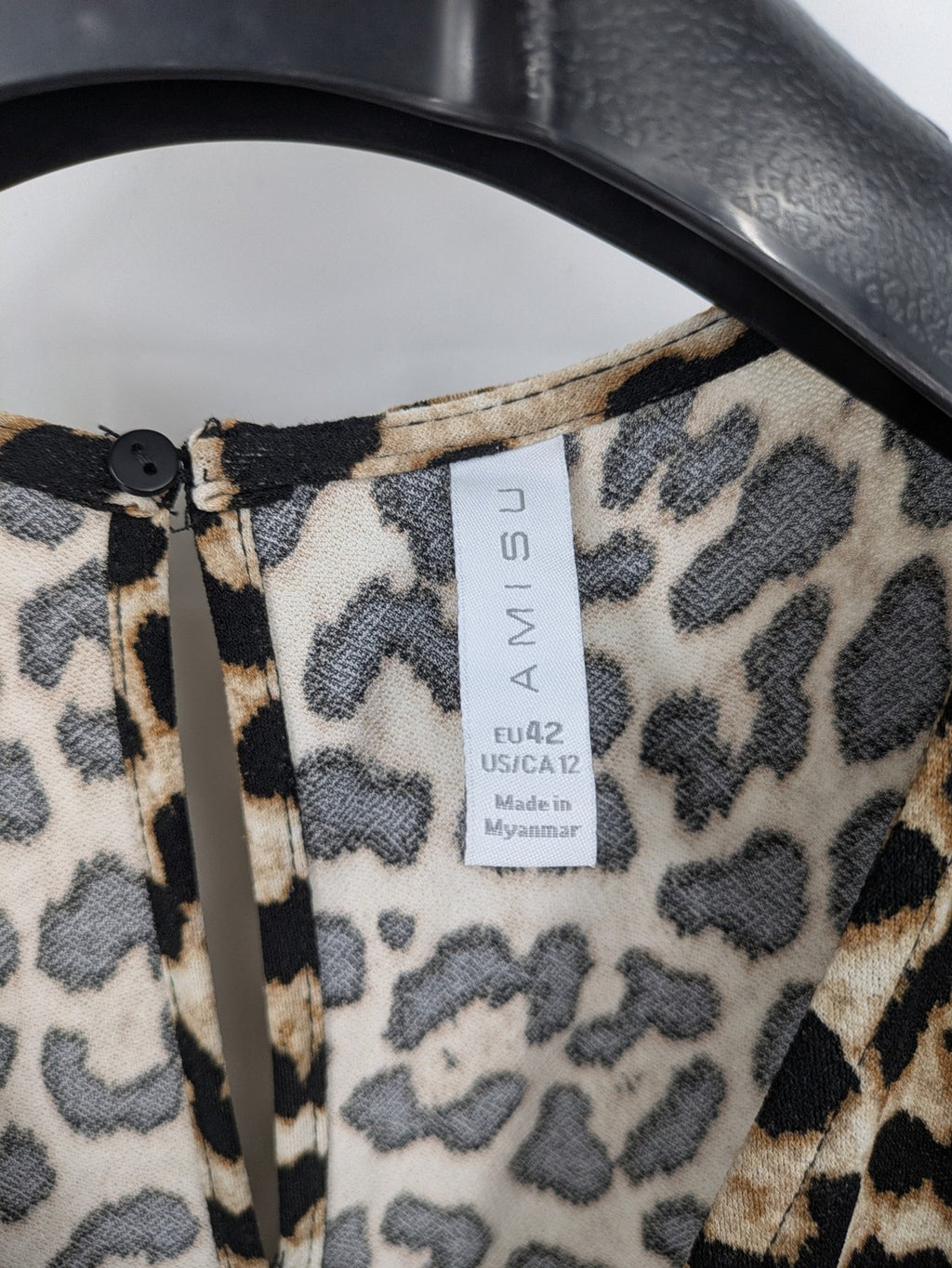 Amisu beige jumpsuit leopard print V-neck, short sleeves, keyhole back detail.