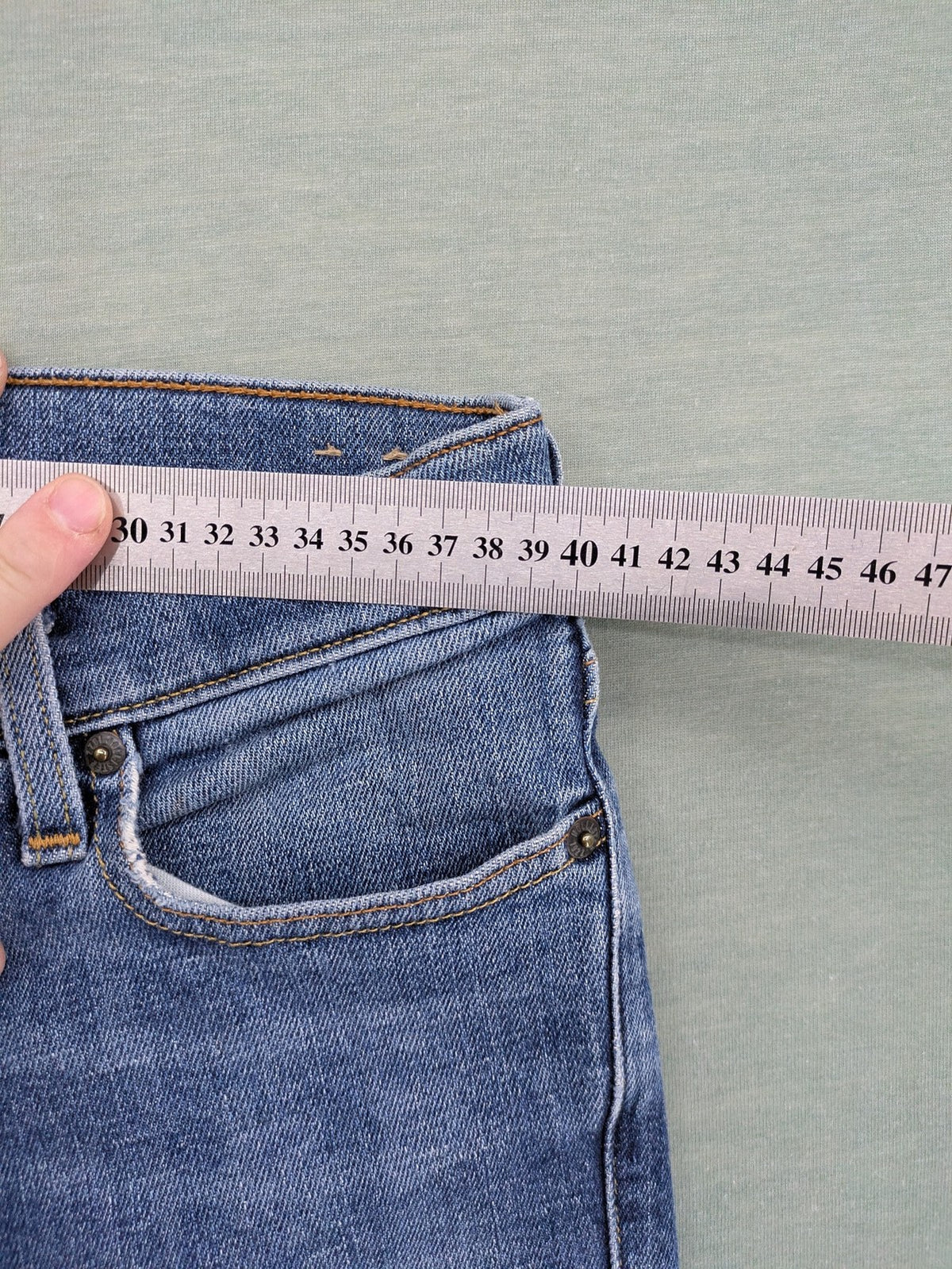 Hollister blue slim fit jeans with classic 5-pocket design and stretch denim material.