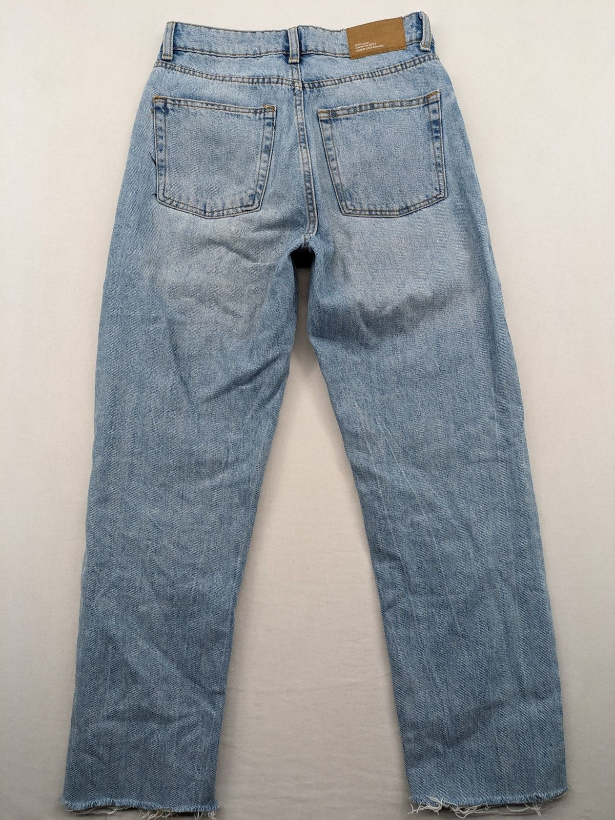 FB Sister blue straight leg jeans high rise with distressed detailing and button fly.