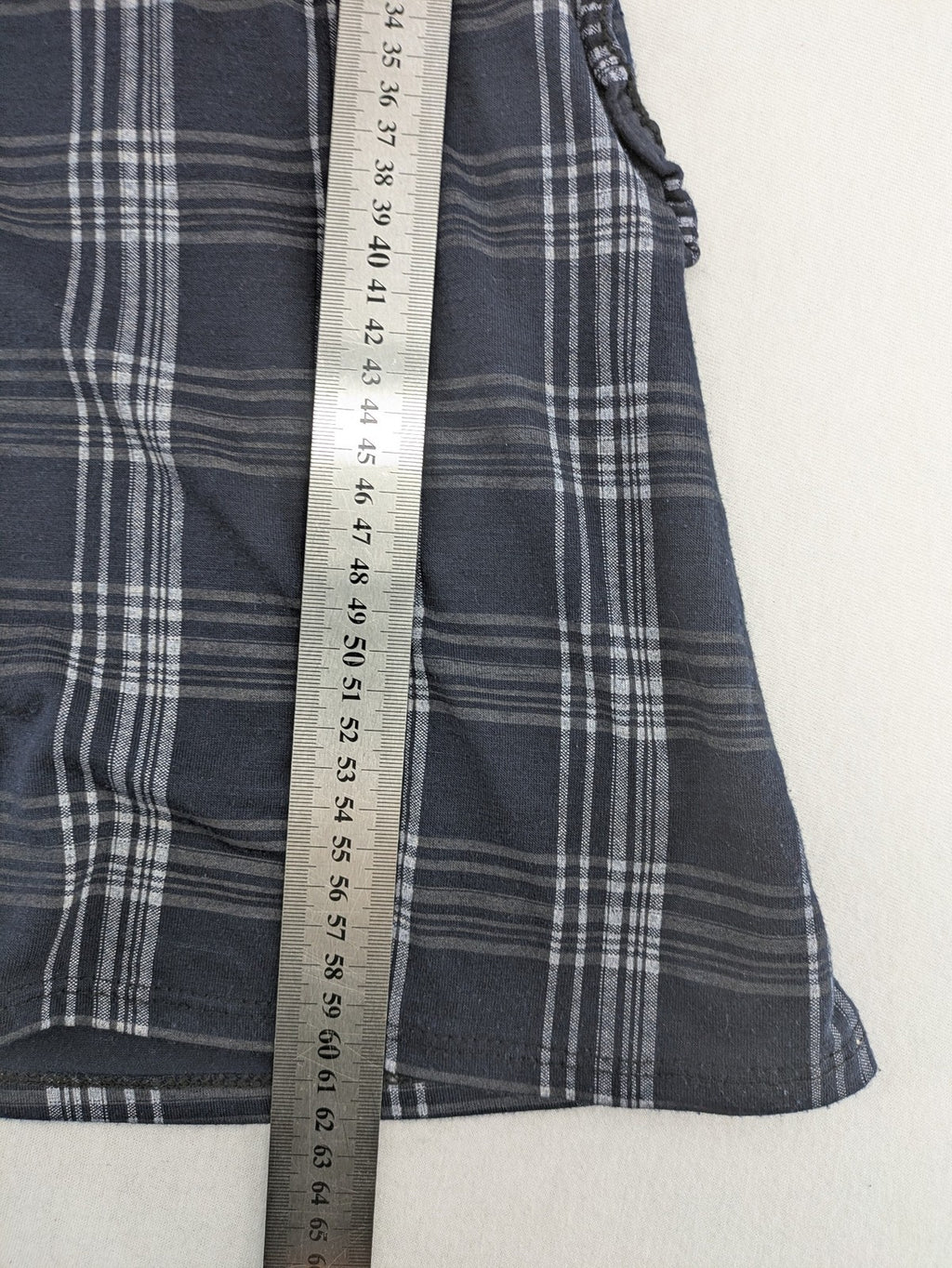 Eleganz navy and white checked top with square neckline and gathered bust detail.