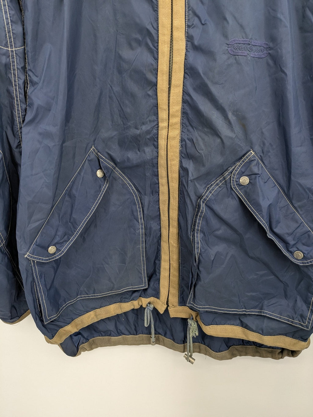 Knock Out navy blue jacket full zip nylon with brown accents and breathable mesh lining.