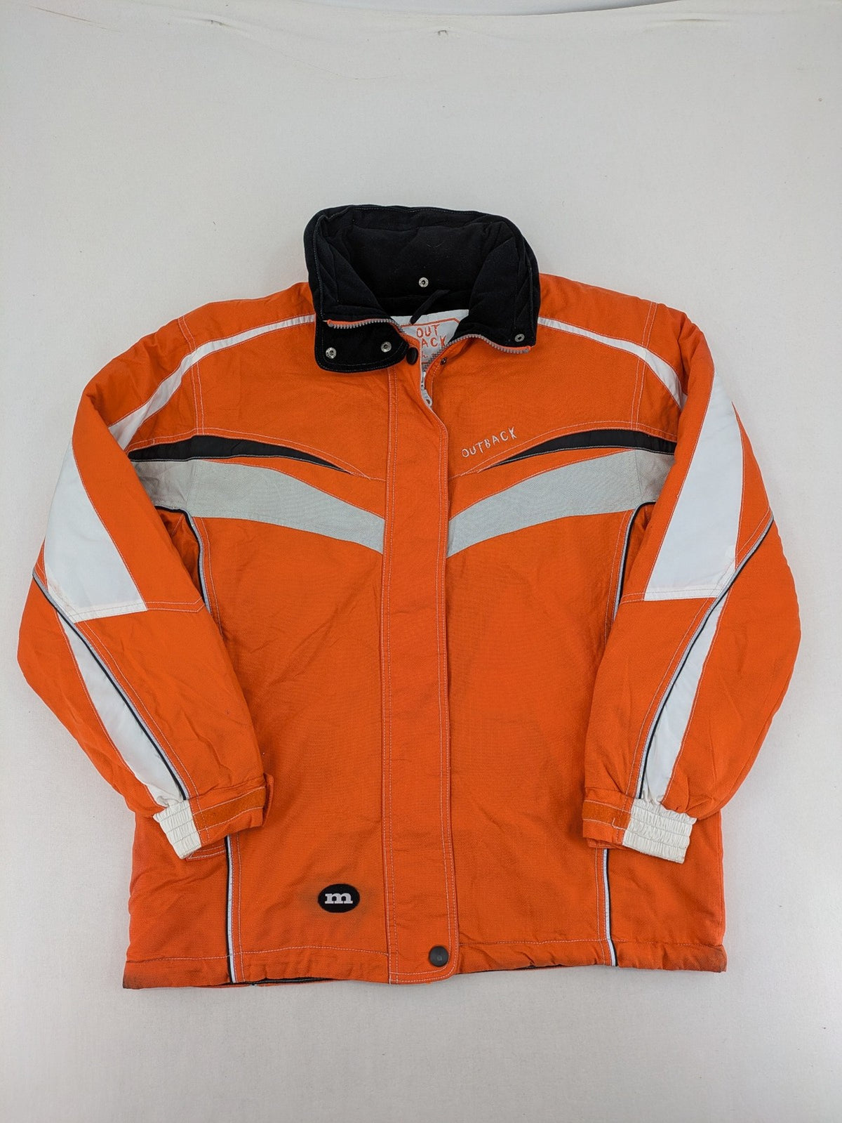 Outback orange outdoor jacket size 42 with reflective accents and mixed color details.