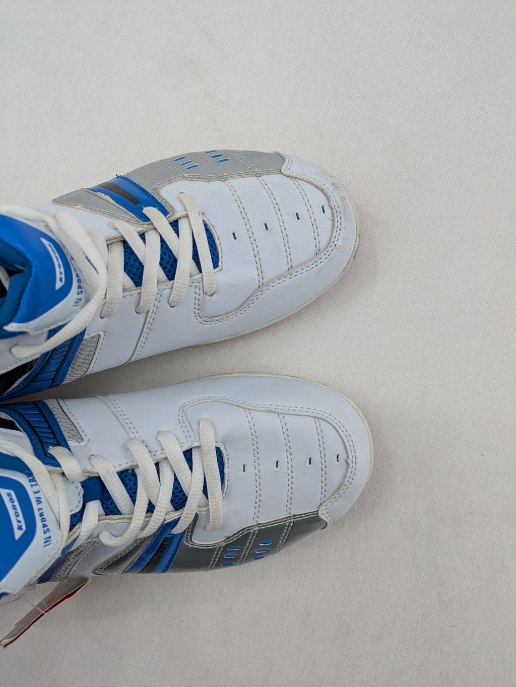 Kronos sports sneakers white, blue, and silver with durable rubber sole and classic design.