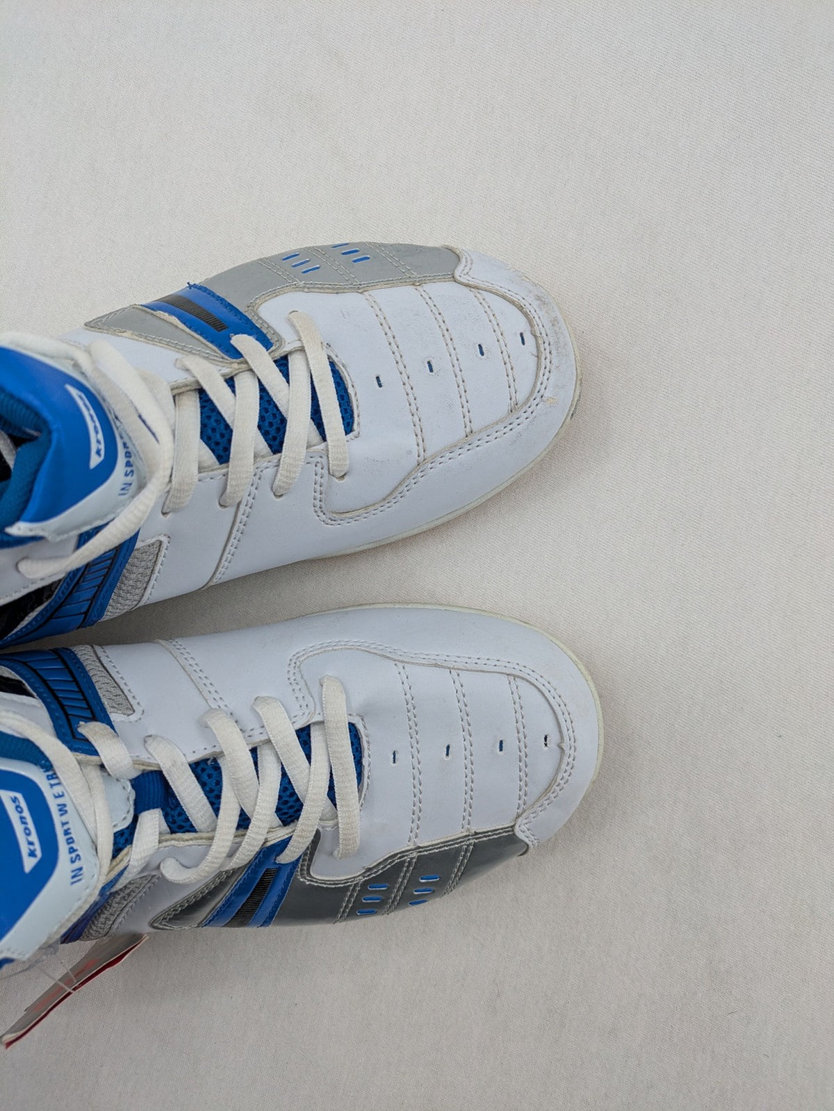 Kronos sports sneakers white, blue, and silver with durable rubber sole and classic design.