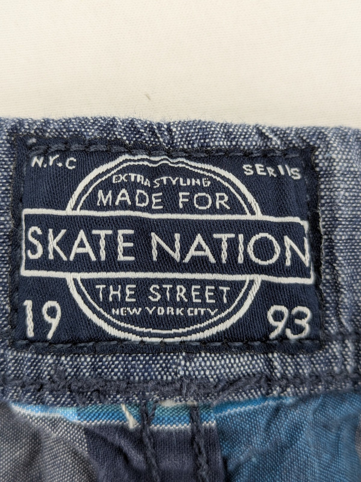 C&A blue checkered shorts with elastic waistband and side pockets, Skate Nation style.