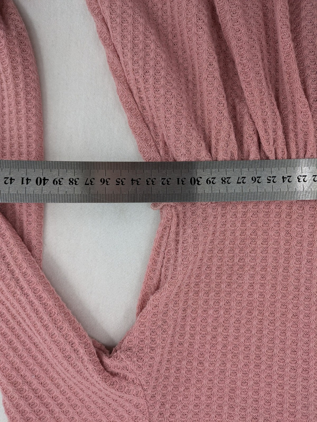 SHEIN pink top V-neck with ruffled waist and three decorative buttons, waffle knit fabric.
