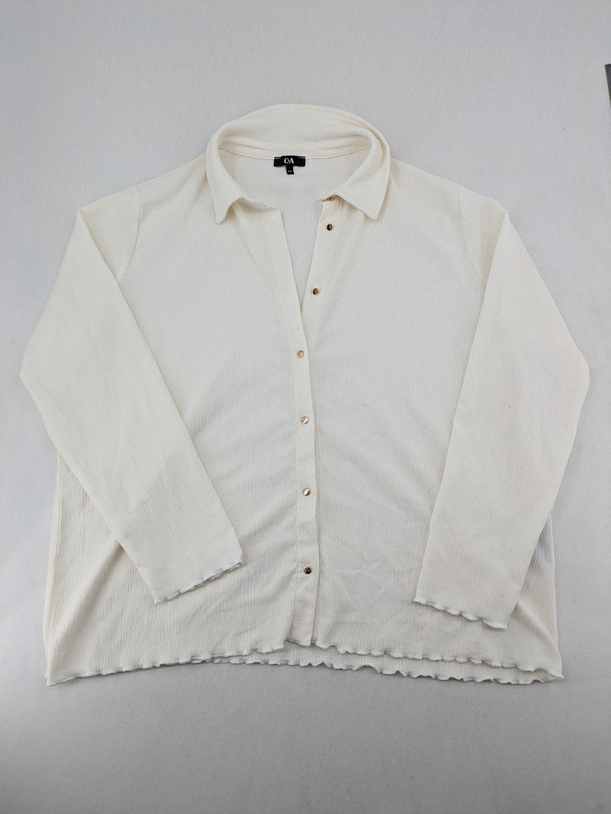 C&A cream blouse XXL textured crinkle fabric with gold button placket and wavy hem.