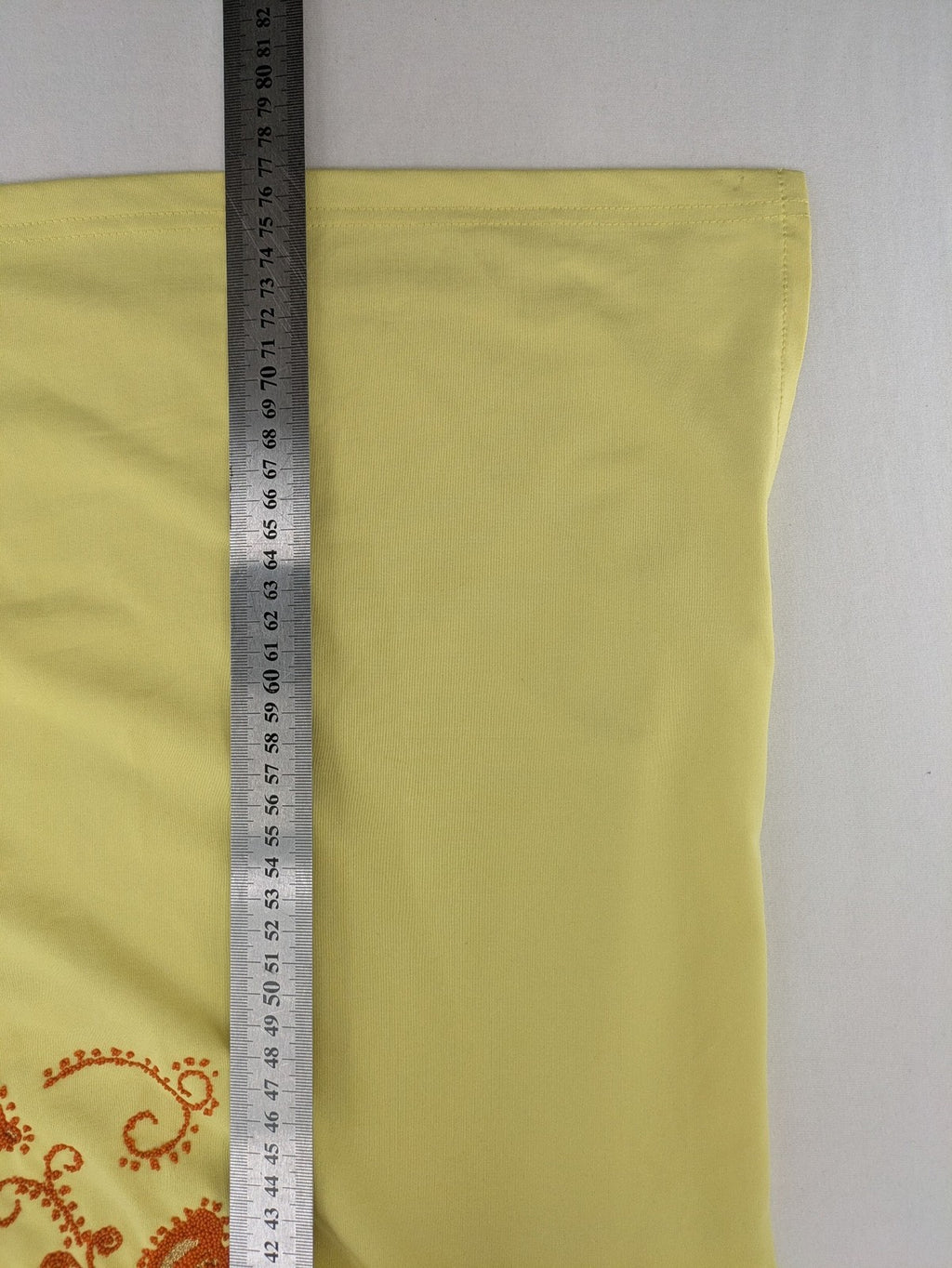 in-Spots yellow t-shirt with butterfly glitter graphic and textured bead details