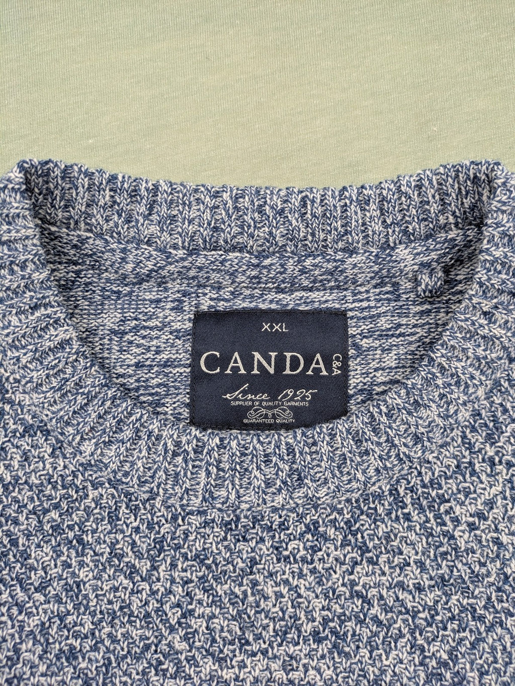 Canda blue-grey melange turtle neck jumper with long sleeves and round neckline.