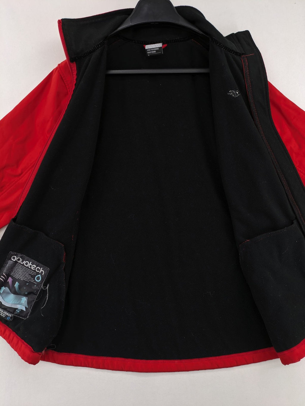 4F red softshell jacket with fleece lining and Aquatech 3000 logo detail.