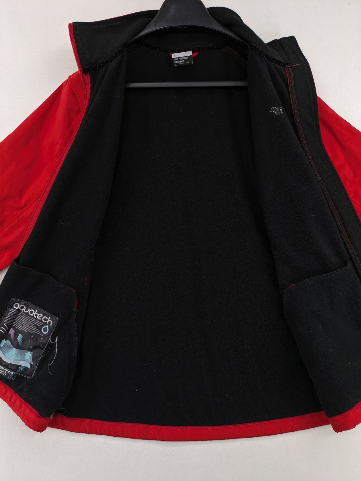4F red softshell jacket with fleece lining and Aquatech 3000 logo detail.