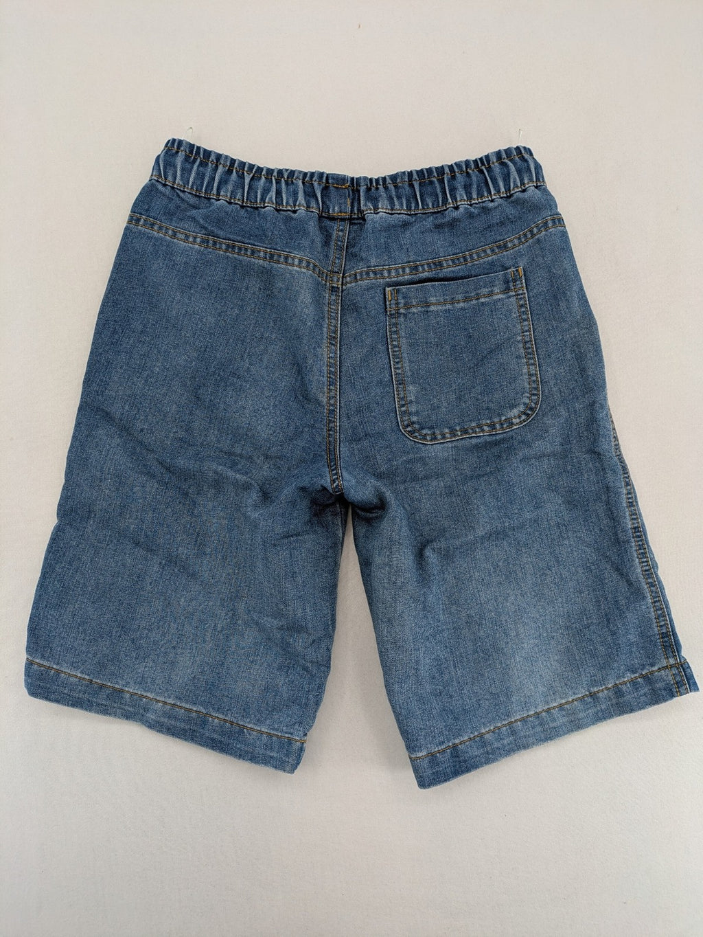 C&A blue denim shorts with elastic waistband and decorative drawstring, classic style.