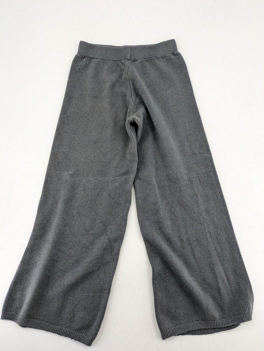 Grey pants with cable knit pattern, wide leg, ribbed waistband, 100% polyester.
