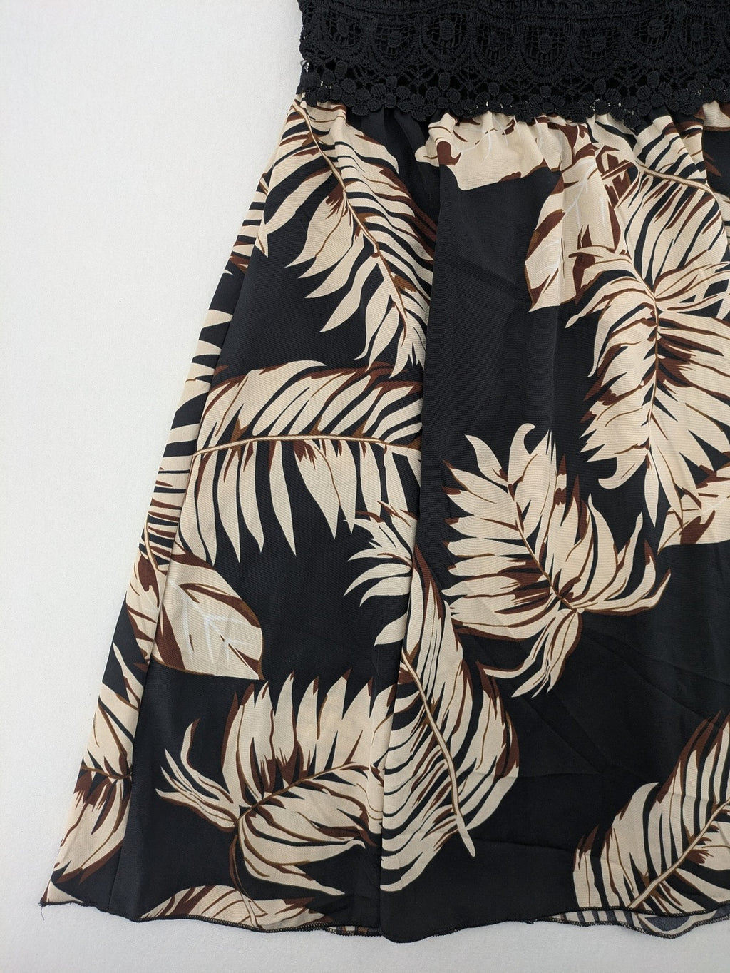 Kontrast summer dress beige tropical leaf print with black ribbed tank top and lace trim.