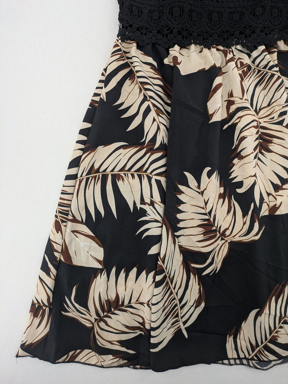 Kontrast summer dress beige tropical leaf print with black ribbed tank top and lace trim.