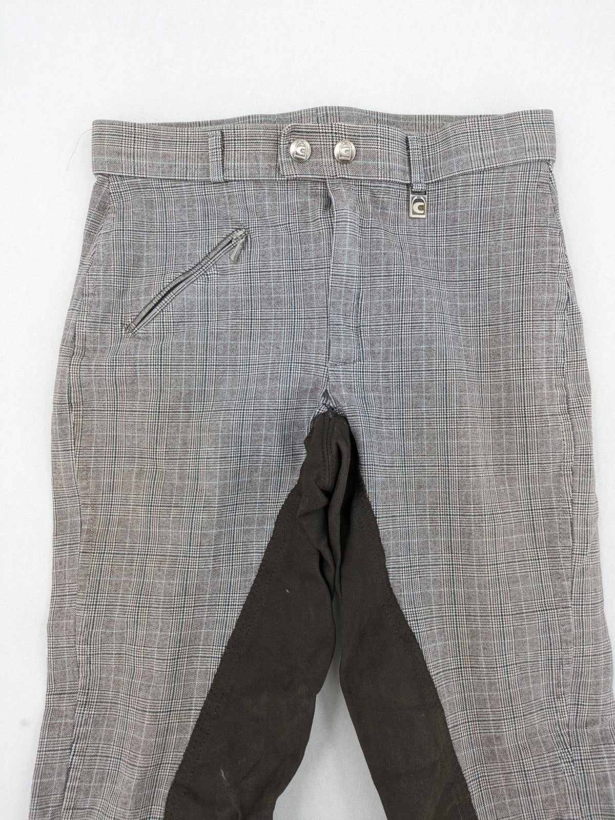 Cavallo grey check riding pants with brown full-seat patch and logo detail.