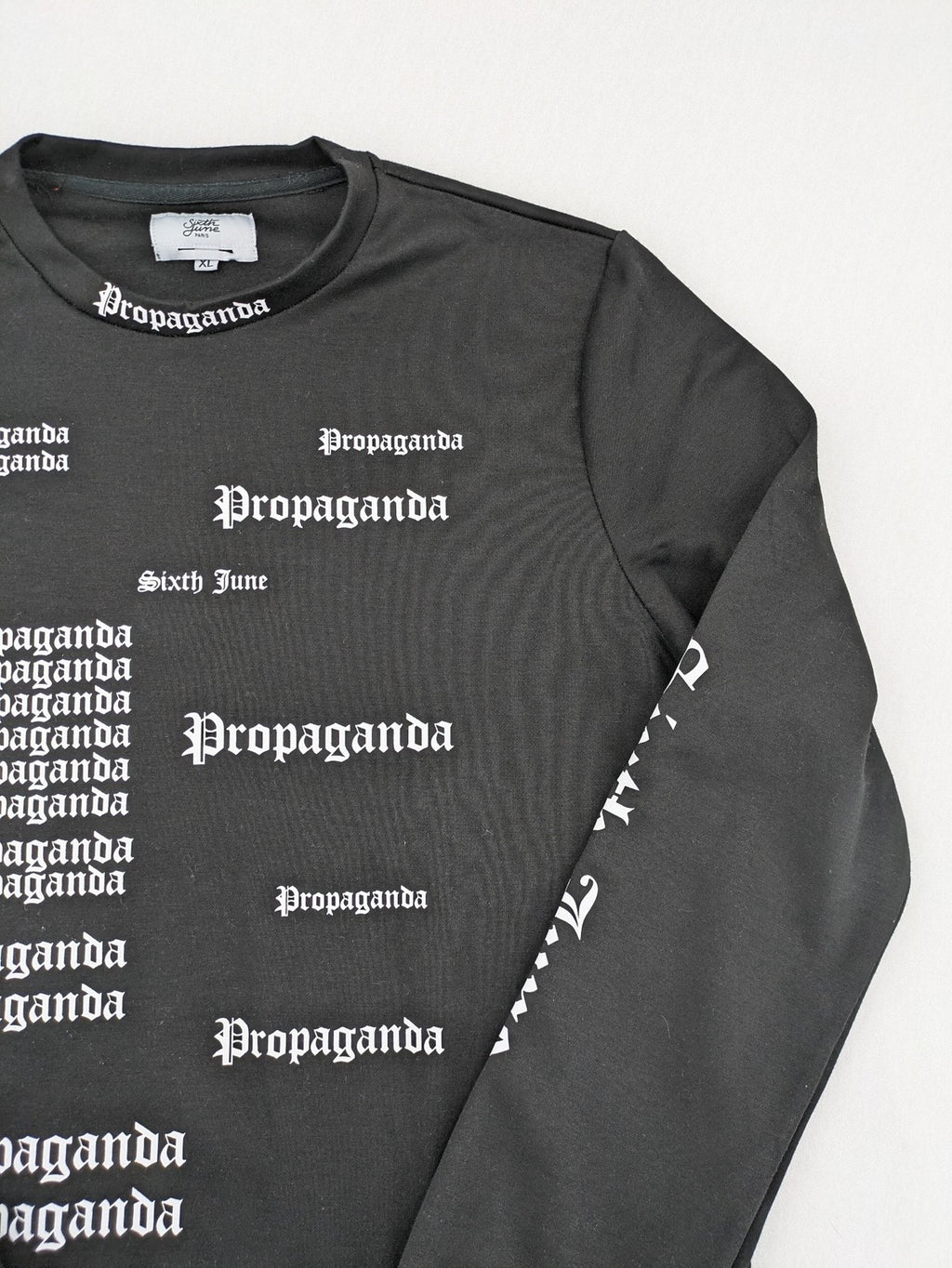 Sixth June black sweatshirt with Gothic "Propaganda" graphic print and logo details.