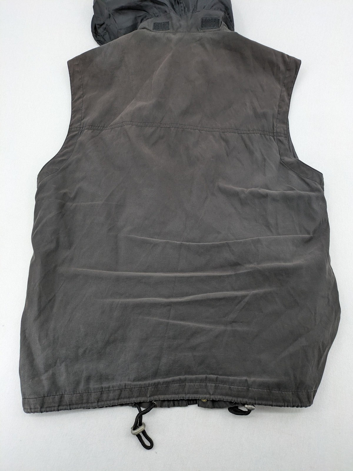 Barisal grey coat with hood, cargo pockets, and checkered lining detail.