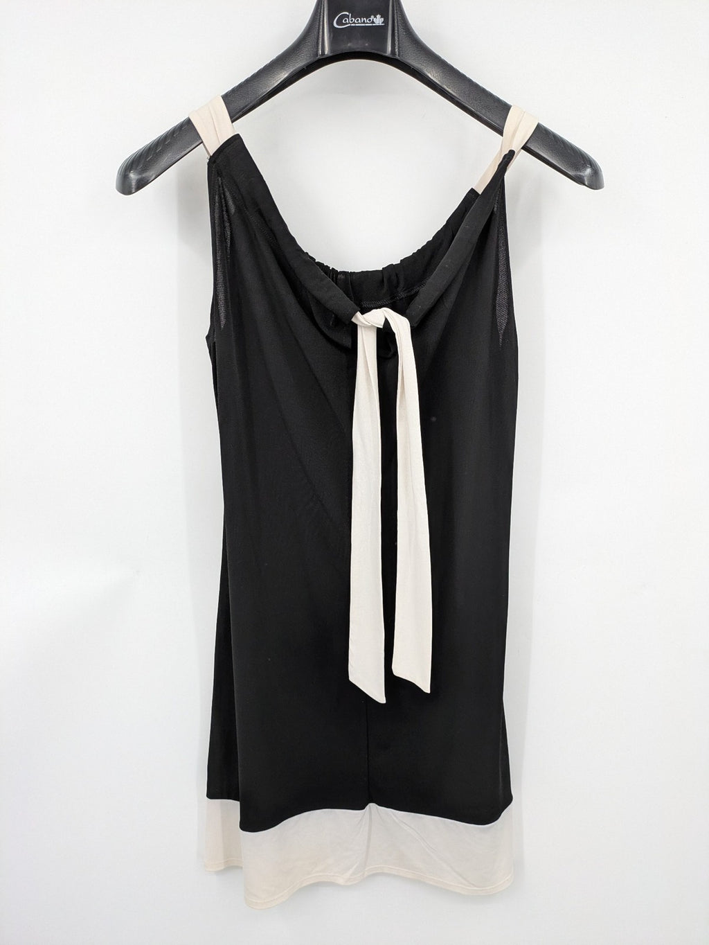 En Focus Studio beige and black top, sleeveless with beaded neckline and tie detail.