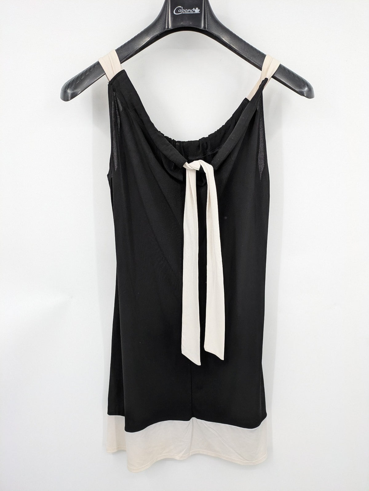 En Focus Studio beige and black top, sleeveless with beaded neckline and tie detail.