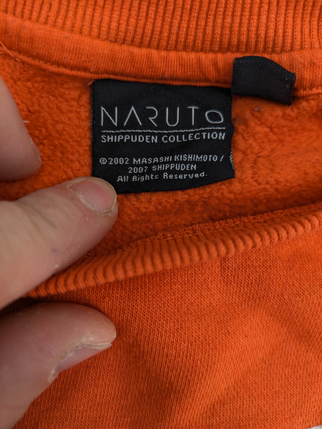 Naruto Shippuden orange sweatshirt featuring vibrant Naruto Uzumaki graphic print, classic crew neck.