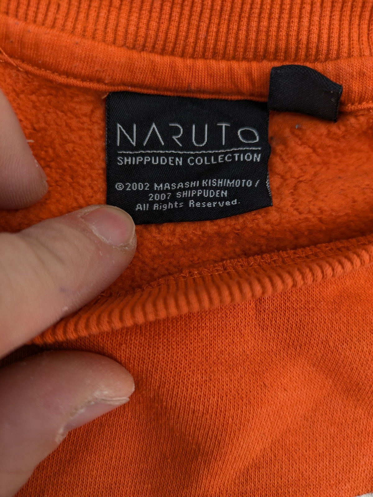 Naruto Shippuden orange sweatshirt featuring vibrant Naruto Uzumaki graphic print, classic crew neck.