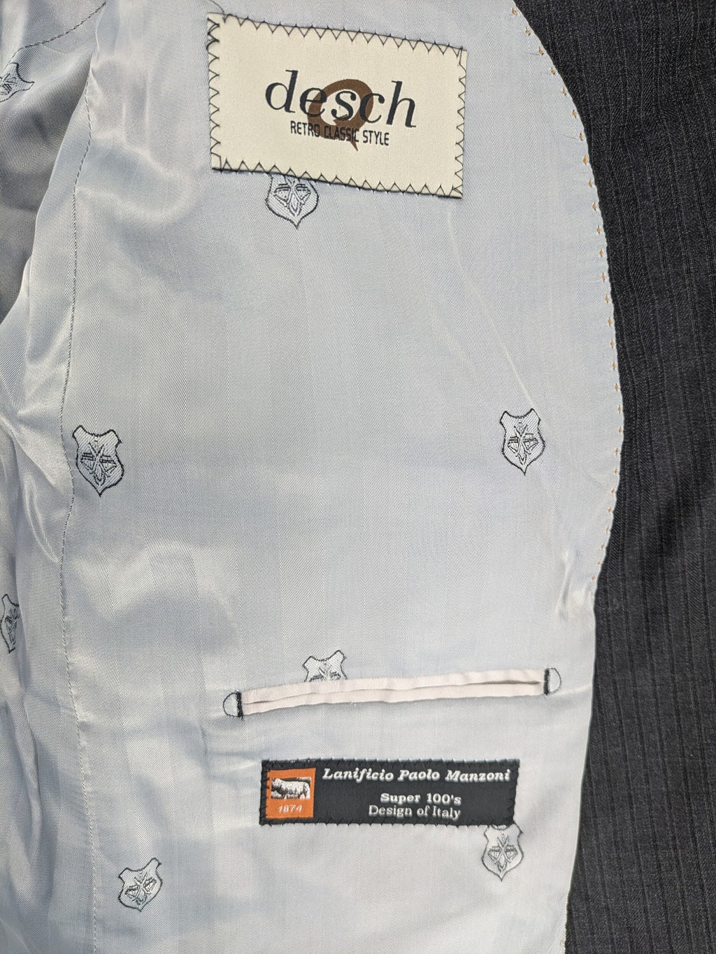 Desch grey blazer with dark grey pinstripe pattern, satin lining, and tailored design.