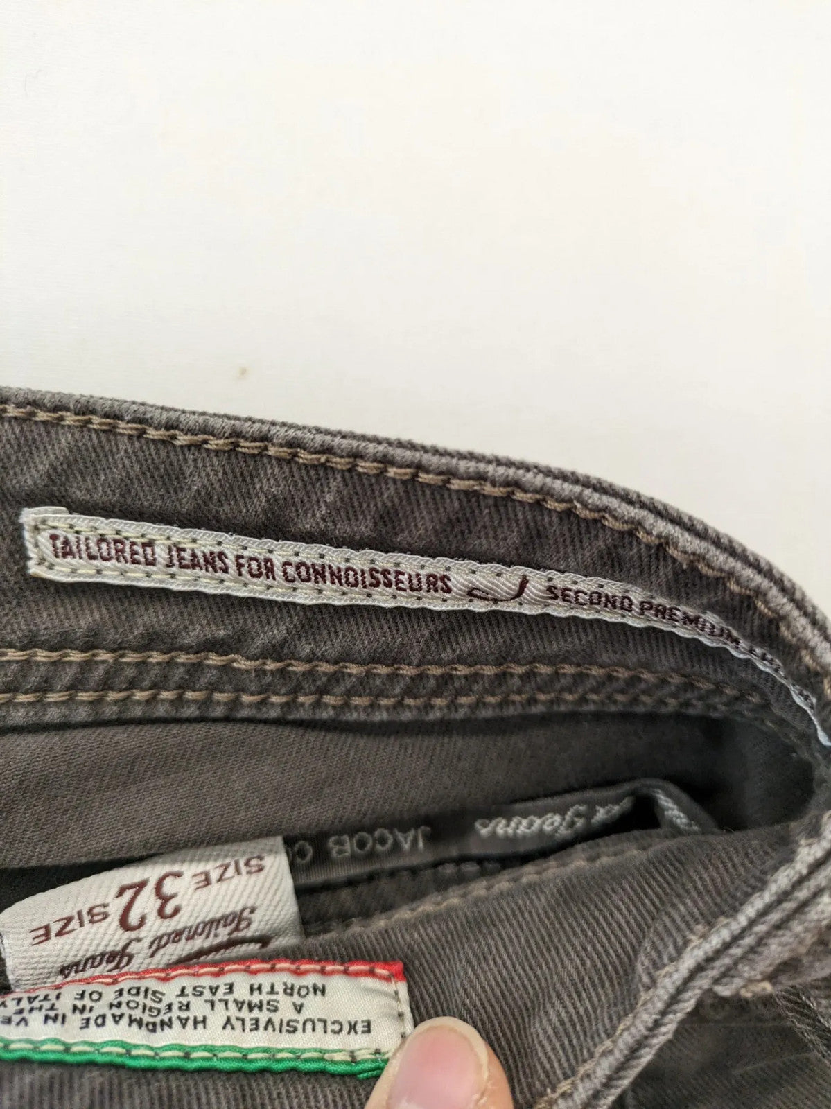 Jacob Cohen black straight jeans with leather logo patch and zip fly, size 32.