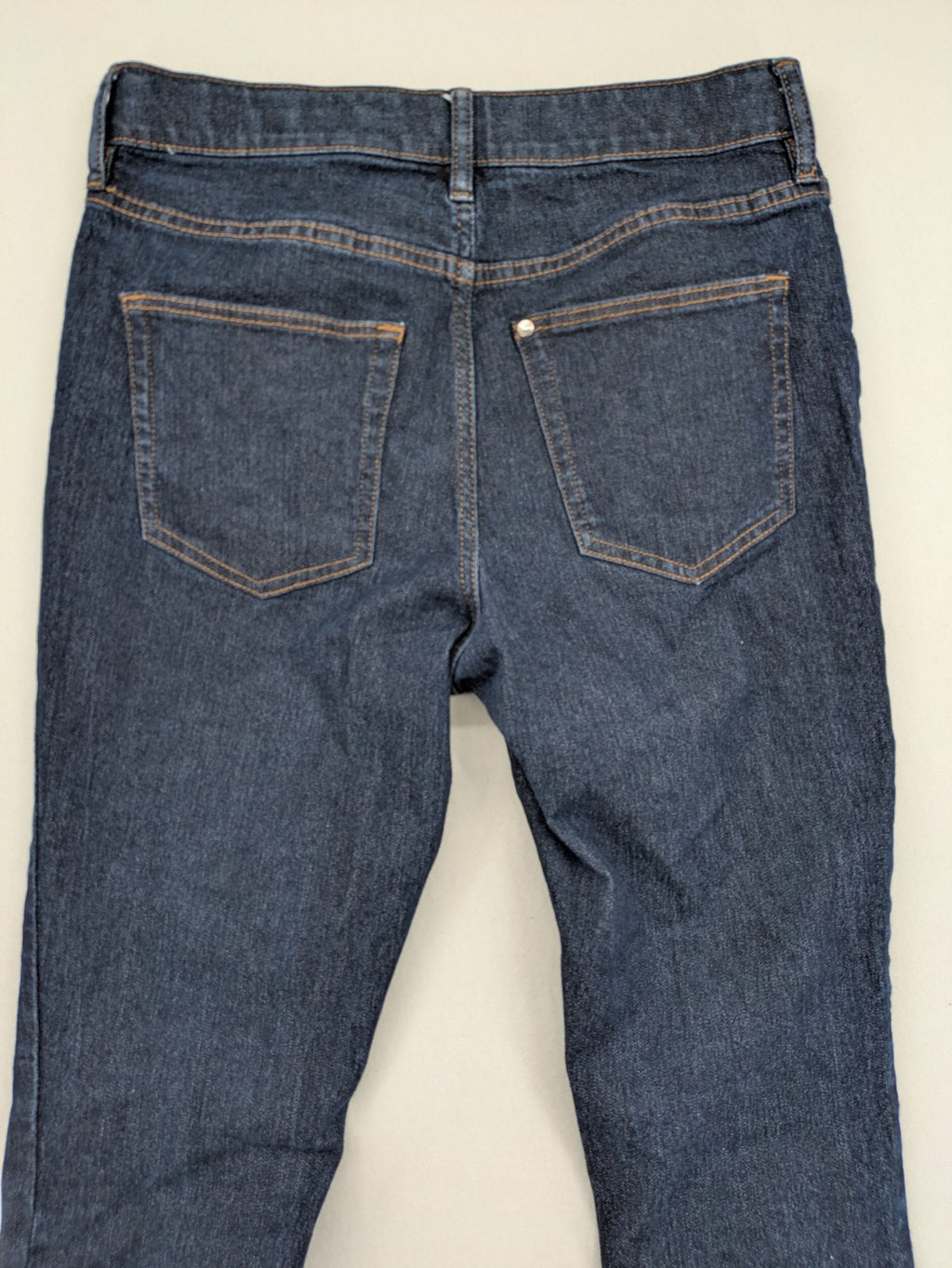 H&M blue skinny fit jeans with classic 5-pocket style and button closure.