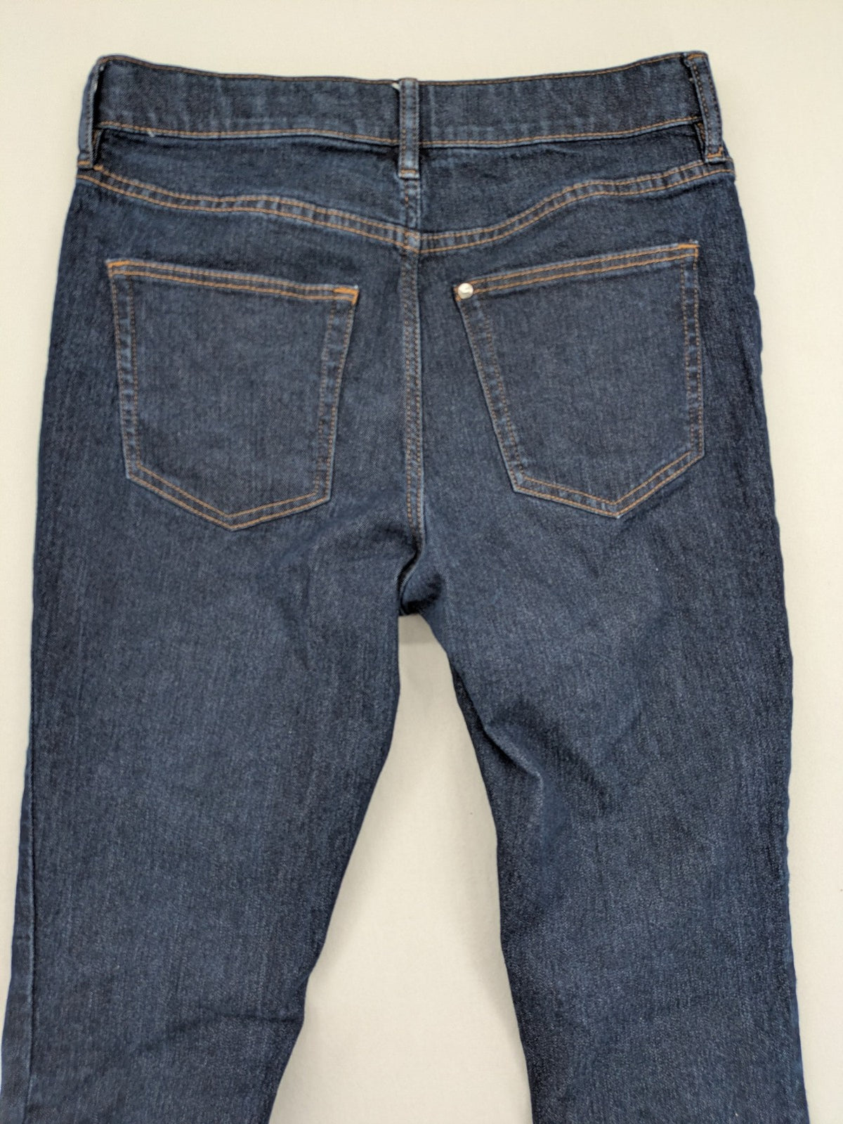 H&M blue skinny fit jeans with classic 5-pocket style and button closure.