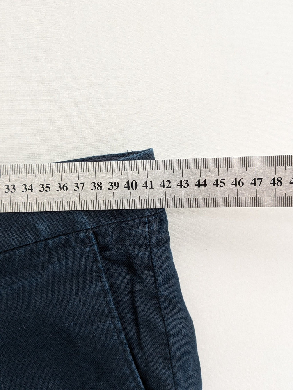 H&M blue linen shorts size 50 flat front design with practical pockets.
