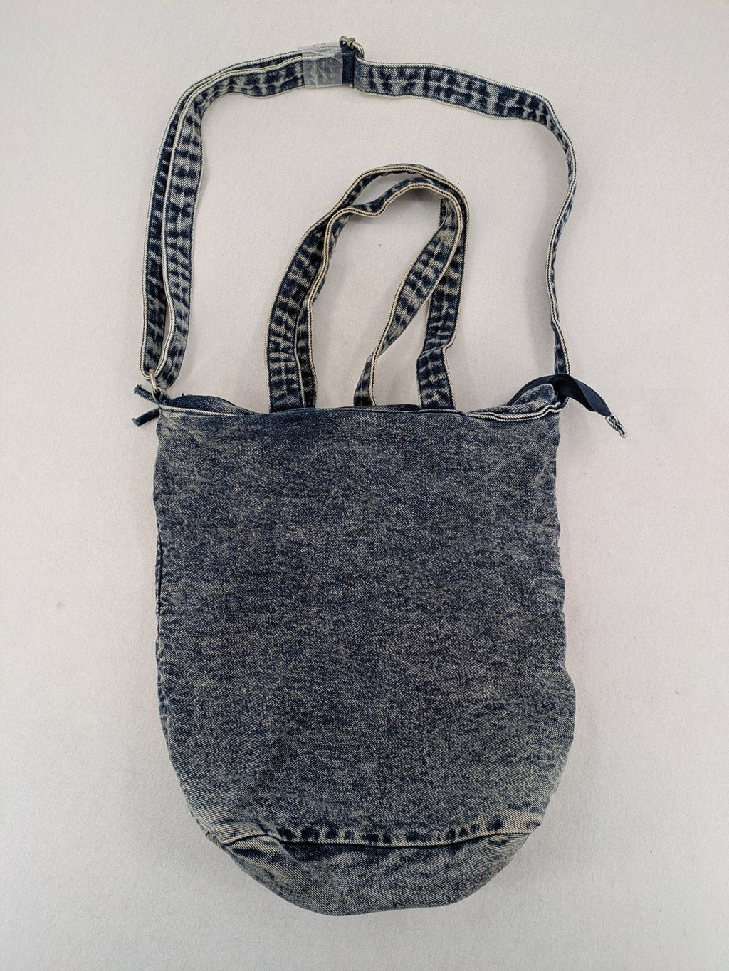 Clockhouse blue acid wash denim tote bag with adjustable shoulder strap and classic handles.