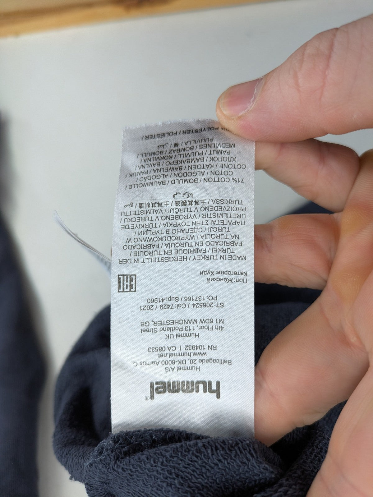 Hummel grey turtle neck jumper featuring large logo, kangaroo pocket, cotton blend material.