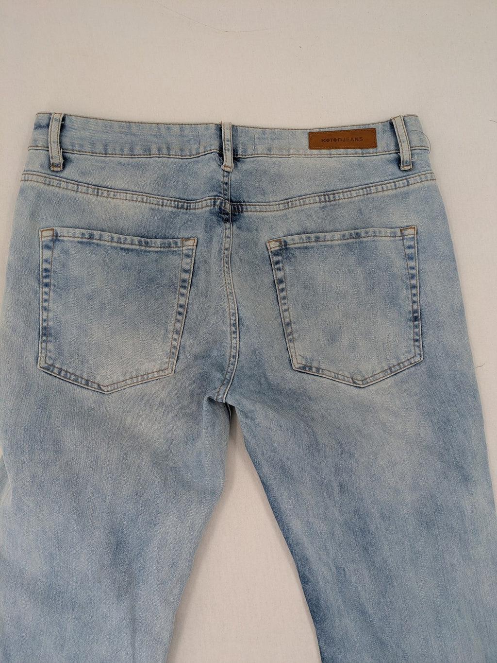 Koton Jeans blue straight jeans with distressed details and classic 5-pocket style.