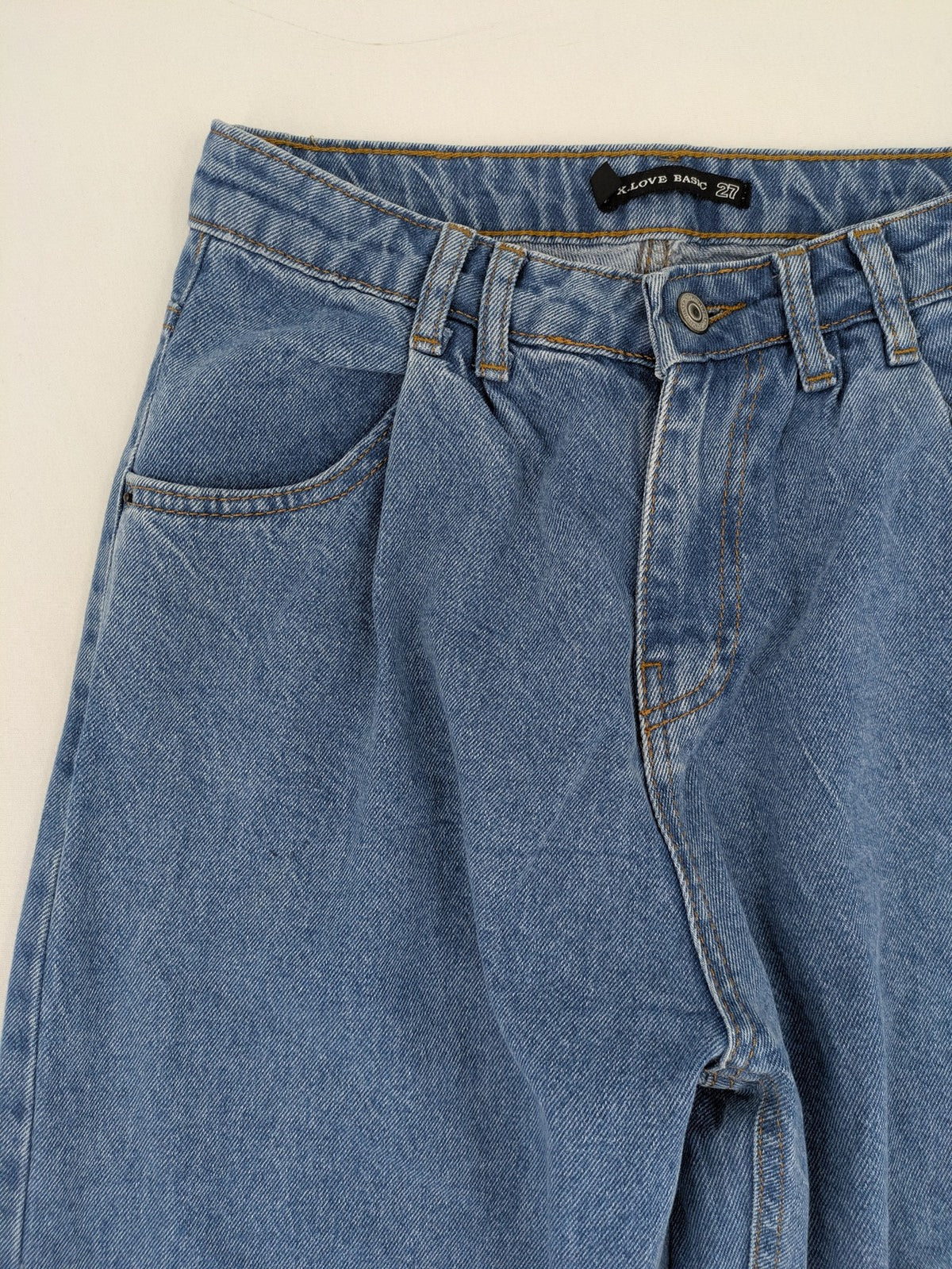 X.LOVE blue high waist wide leg jeans with front pleats and frayed hem.