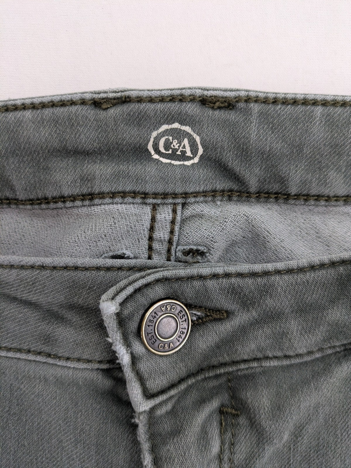 C&A grey skinny jeans with classic 5-pocket design and stretch cotton blend.